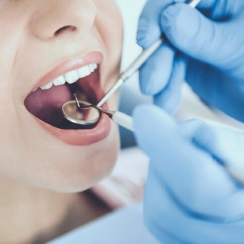 Dental patient receiving oral cancer screening