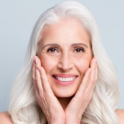 Woman with dental implants smiling