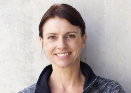Woman smiling in a black jacket