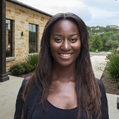 Woman smiling outside of dental office in San Antonio