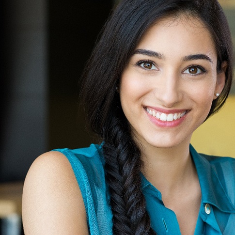 Patient placing clear aligners in Candid case