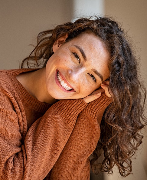 Woman smiling on couch