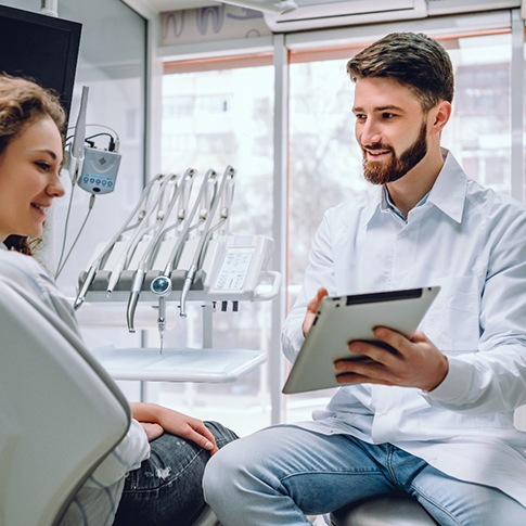 Woman speaking with dentist