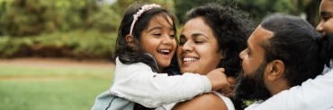 Parents and child smiling after children's dentistry visit