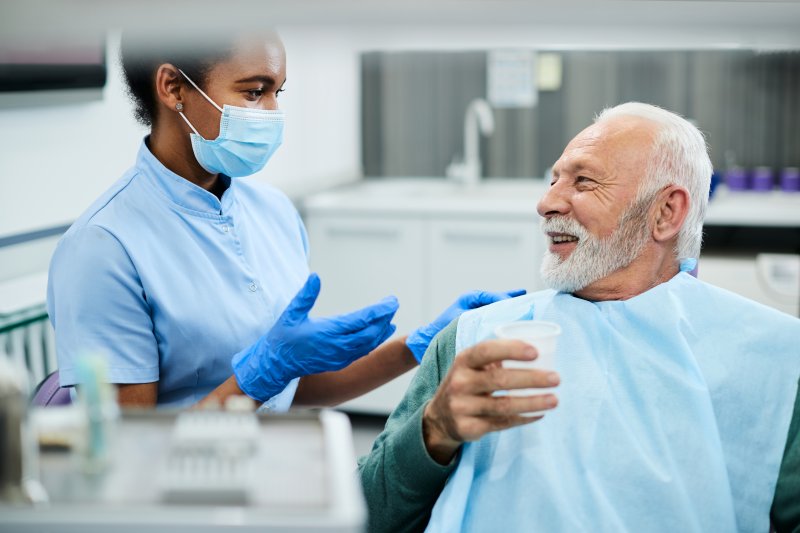 patient talking to their dentist
